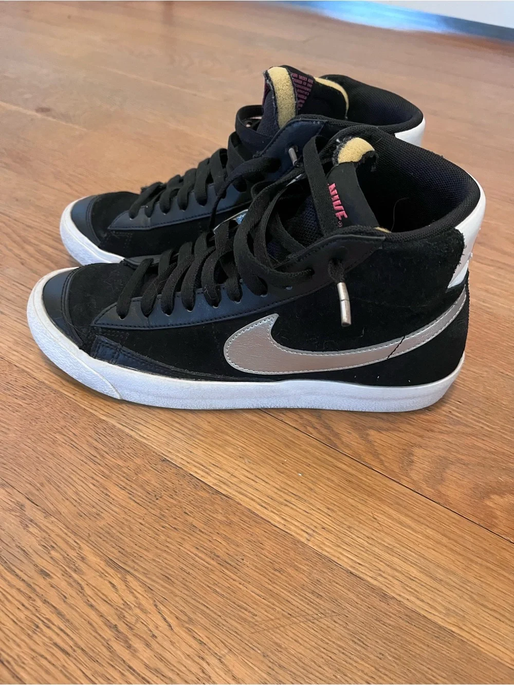 Nike Black High-Top Sneakers with White Sole and Pink Logo
